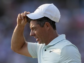 Rory McIlroy, of Northern Ireland, reacts after missing a putt on the 18th hole during the final round of the U.S. Open golf tournament Sunday, June 16, 2024, in Pinehurst, N.C.
