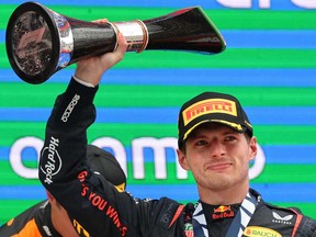 Red Bull's Dutch driver Max Verstappen celebrates on the podium winning the Spanish Formula One Grand Prix at the Circuit de Catalunya on June 23, 2024 in Montmelo, on the outskirts of Barcelona.