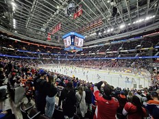 Fans watch the pregame skate