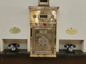 A vintage mailbox and phones