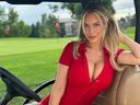 Golf influencer Paige Spiranac sits in a golf cart.