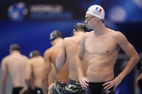 Leon Marchand of France, right, prepares to compete during the men's 200m butterfly final at the World Swimming Championships.