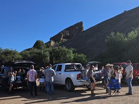 Concert-goers enjoy a honky-tonk tailgate at Red Rocks Amphitheatre.