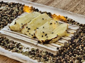 The haloumi was set alight right at our table at AVA MediterrAegean in Orlando's Winter Park neighbourhood. Laura Shantora Nelles/Toronto Sun
