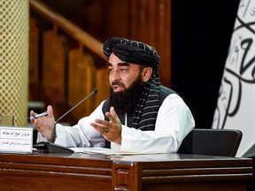 A Taliban spokesman addresses a news conference.