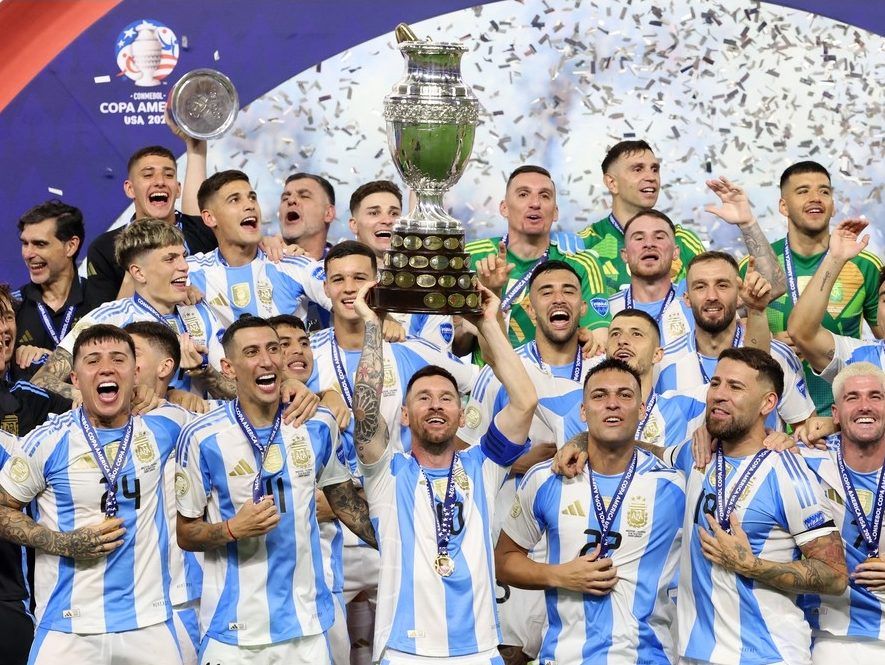 Argentina's forward #10 Lionel Messi lifts up the trophy as he celebrates winning the Conmebol 2024 Copa America tournament final football match between Argentina and Colombia at the Hard Rock Stadium, in Miami, Florida on July 14, 2024. 