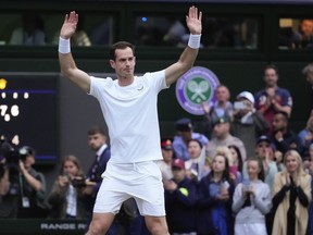 Britain's Andy Murray waves to the Center Court crowd