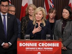 Bonnie Crombie stands with Ontario Liberal caucus members as she talks to the media at the Queens Park in Toronto on Tuesday, December 5, 2023. THE CANADIAN PRESS/Chris Young