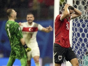 Austria's Christoph Baumgartner reacts following a save by Turkey's goalkeeper Mert Gunok.