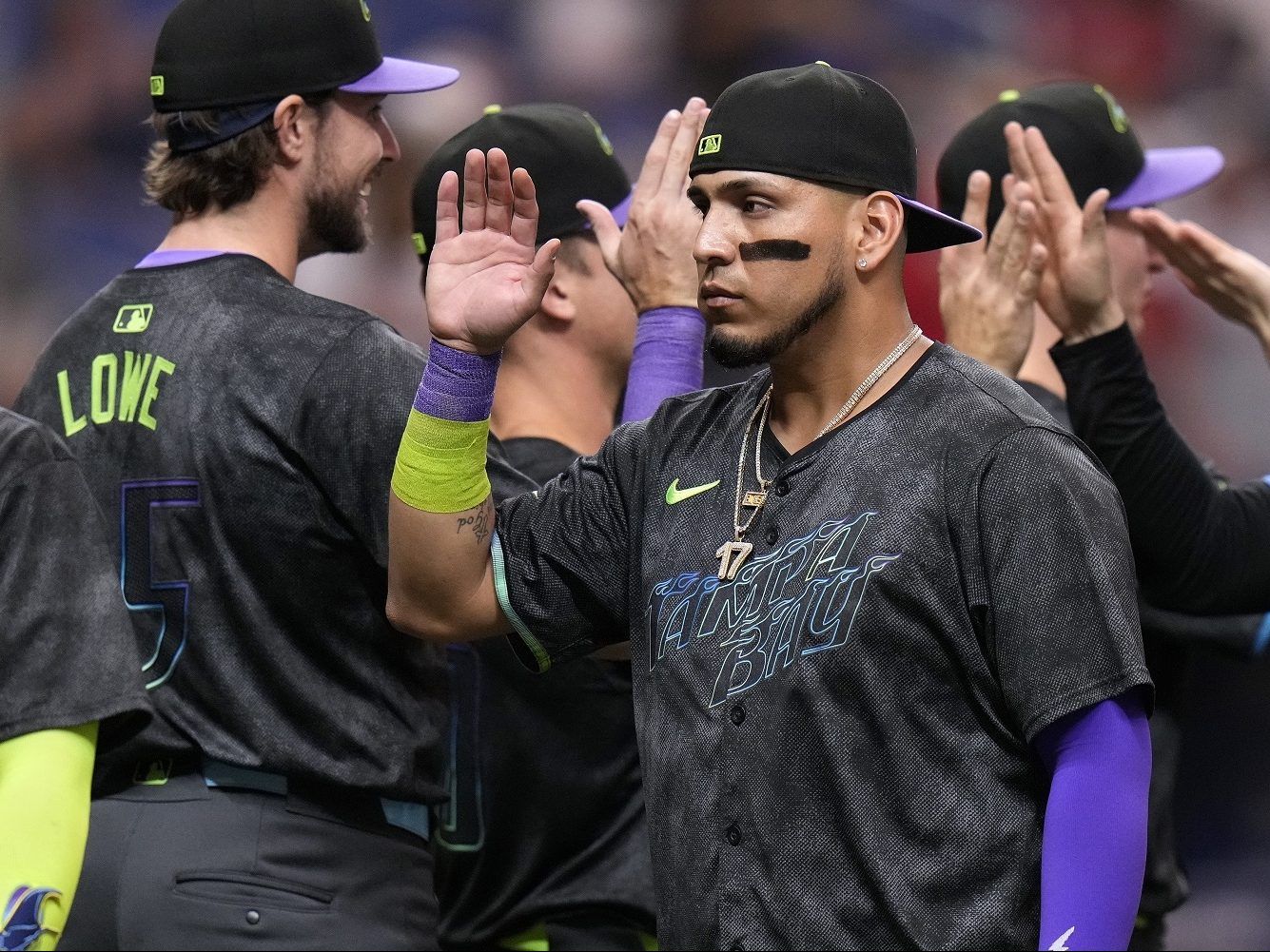 The Tampa Bay Rays' Isaac Paredes celebrates with teammates.