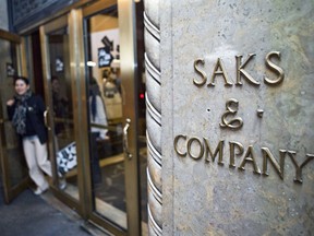 A customer leaves the Saks Fifth Avenue department store