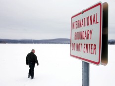 Open border area covered in snow between Canada and U,S.