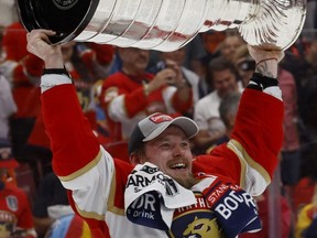 Vladimir Tarasenko of the Florida Panthers lifts the Stanley Cup after Florida's 2-1 victory against the Edmonton Oilers in Game Seven of the 2024 Stanley Cup Final at Amerant Bank Arena in Sunrise, Fla., June 24, 2024.