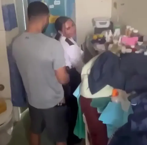 A screenshot from video of prison guard Linda De Sousa Abreu appearing to have sex with a convict.