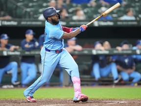 Vladimir Guerrero Jr. of the Toronto Blue Jays doubles in a run in the ninth inning during game two of a doubleheader baseball game against the Baltimore Orioles at the Oriole Park at Camden Yards on July 29, 2024 in Baltimore, Md.