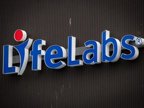 Ontario pension fund manager OMERS has signed a deal to sell medical lab company LifeLabs to U.S.-based firm Quest Diagnostics in a deal valued at $1.35 billion including debt. A sign is seen outside a LifeLabs location in North Vancouver, B.C., Friday, Oct. 22, 2021.