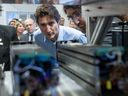 Prime Minister Justin Trudeau looks at hydrogen fuel cell technology during a visit to the University of Trois-Rivieres, Que., Wednesday, Jan. 18, 2023 in Trois-Rivieres, Que.