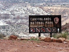 A sign for Canyonlands National Park is seen