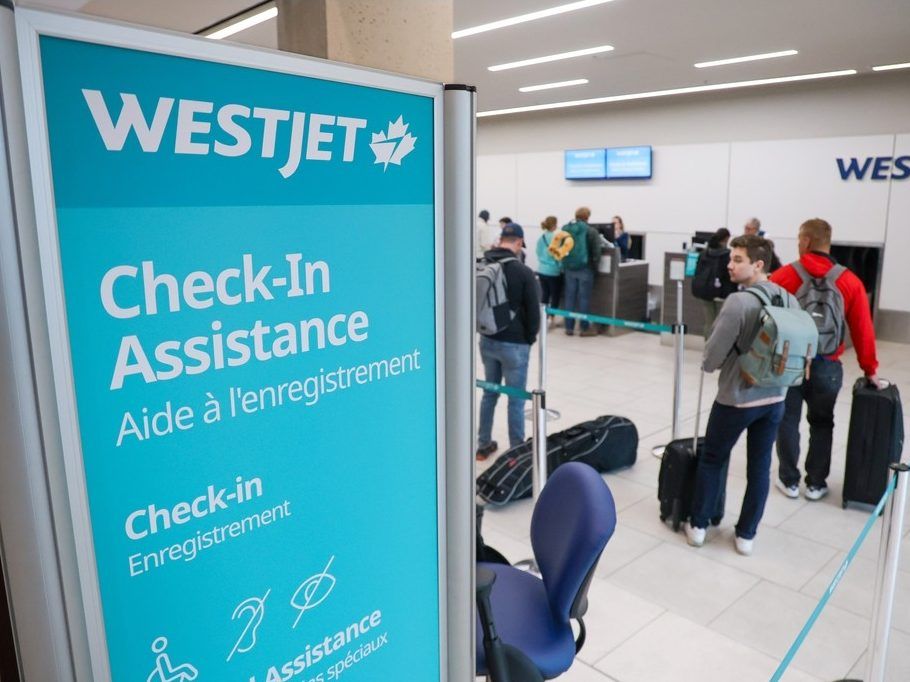 West Jet customers who had flights that were not cancelled check in at the Calgary International Airport following the end of the WestJet mechanics strike on Monday July 1, 2024. 
 