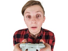 Closeup portrait of a kid playing video games.