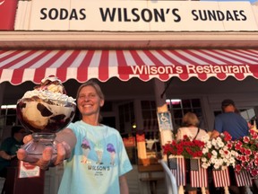 Wilson’s Restaurant & Ice Cream Parlor owner Sarah Martin holds up the ‘Eagle Harbor Perfection’ sundae. IAN SHANTZ/TORONTO SUN