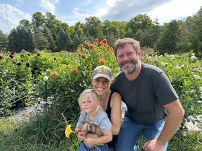 Sara and John Lancaster own OneEighty Petals, a pick-your-own bouquet business, and they get some help from their young kids Evangeline and Jack, even though one of the kids was camera-shy. IAN SHANTZ/TORONTO SUN