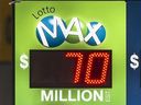 A Lotto Max sign is seen in a window in downtown Toronto, May 6, 2022.