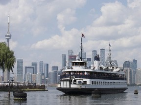 A full ferry arrives at the Toronto Island