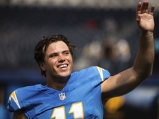 Los Angeles Chargers kicker Cameron Dicker (11) waves towards the stands before an NFL preseason football game against the Los Angeles Rams, Aug. 17, 2024, in Inglewood, Calif.