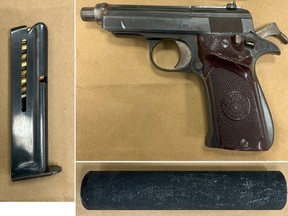 A firearm, ammunition and a suppressor seized by Toronto Police.