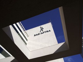 SAG-AFTRA signage is seen on the side of the headquarters in Los Angeles on Friday, Nov. 10, 2023.Hollywood's video game performers voted to go on strike Thursday, July 25, 2024, throwing part of the entertainment industry into another work stoppage after talks for a new contract with major game studios broke down over artificial intelligence protections.