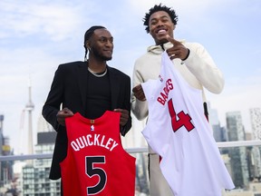 Immanuel Quickley and Scottie Barnes of the Toronto Raptors pose for a photo after a press conference in July.