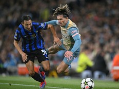 Inter Milan defender Matteo Darmian (left) fouls Manchester City's Jack Grealish during a UEFA Champions League game.