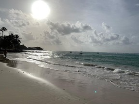 The sun shines on the beach in Barbados. HANDOUT
