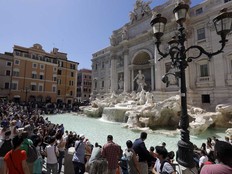 Tourists admire the Trevi Fountain in Rome, June 7, 2017.