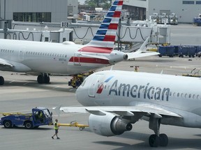 American Airlines passenger jets prepare for departure