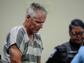Colin Gray, 54, the father of Apalachee High School shooting suspect Colt Gray, 14, enters the Barrow County courthouse for his first appearance, on Sept. 6, 2024, in Winder, Ga.