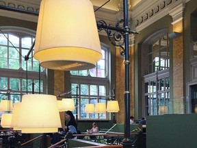 Closeup of light fixtures and tables in McDonalds in Nyugati Rail Station in Budapest.