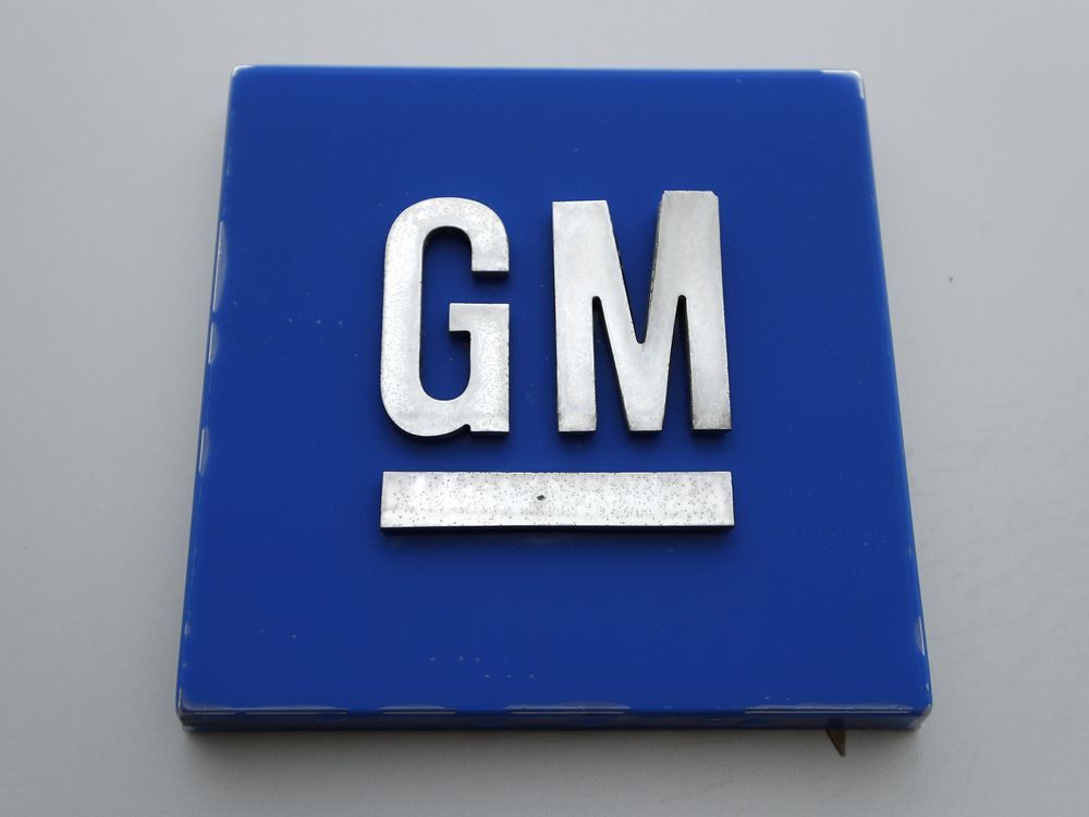 FILE - The General Motors logo stands outside the General Motors Detroit-Hamtramck Assembly Plant, Jan. 27, 2020, in Hamtramck, Michigan.
