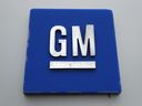 FILE - The General Motors logo stands outside the General Motors Detroit-Hamtramck Assembly Plant, Jan. 27, 2020, in Hamtramck, Michigan.
