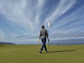 Postmedia's Jon McCarthy walks towards one of his many missed putts during the 100 Hole Hike at Cabot Cape Breton.