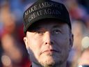 Tesla and SpaceX CEO Elon Musk listens as Republican presidential nominee former President Donald Trump speaks at a campaign event at the Butler Farm Show, Saturday, Oct. 5, 2024, in Butler, Pa.