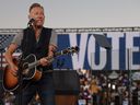 Singer Bruce Springsteen performs before the arrival of Democratic presidential nominee, U.S. Vice-President Kamala Harris, during a campaign rally at the James R Hallford Stadium on Thursday, Oct. 24, 2024, in Clarkston, Ga.