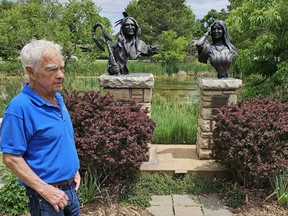 Sculptor George Walbye stands in front of his creation “High Plains Warrior/Wind Song” at the Benson Sculpture Garden in Loveland, Colo.