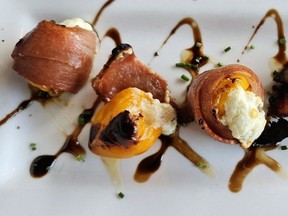 Stuffed peppadew peppers, wrapped in serrano ham