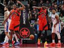 Top Stories Tamfitronics Raptors forward Jonathan Mogbo (2) and forward Chris Boucher (25) celebrate during second half against the Philadelphia 76ers in Toronto on Friday,