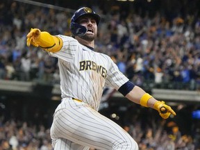 Milwaukee Brewers' Garrett Mitchell celebrates afrer hitting a two-run home run during the eighth inning of Game 2 of a National League wild card baseball game against the New York Mets Wednesday, Oct. 2, 2024, in Milwaukee.