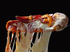 Pizza slice with melted cheese.