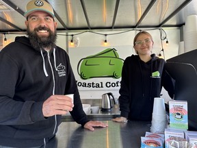 Coastal Coffee owner Ben Gingerich mans his coffee trailer along with daughter Maeva at the Goderich farmers’ market. IAN SHANTZ/TORONTO SUN
