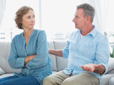 A husband and wife disagree on how to deal with an adult child who lives rent-free at home.
